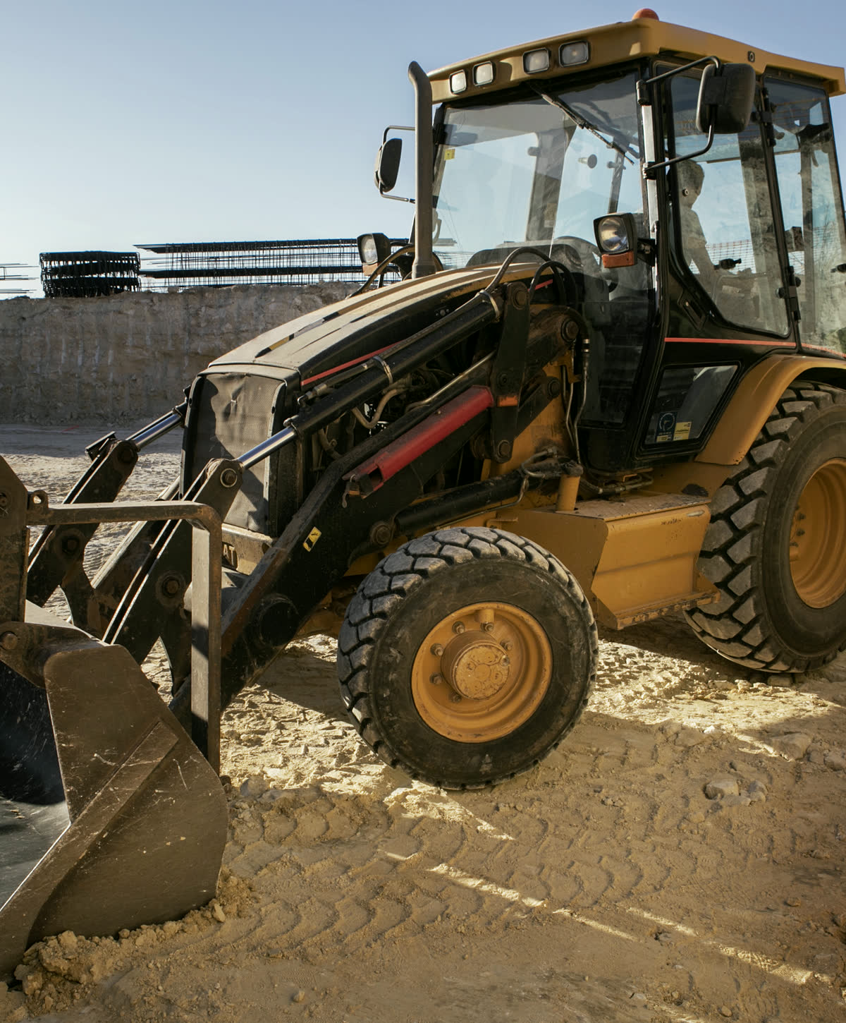 Backhoe loader prepared for construction work on site